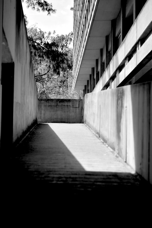 the back of an overpass with one person in the distance