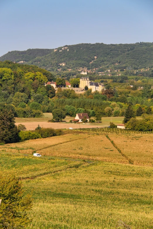 the countryside is in front of some mountains