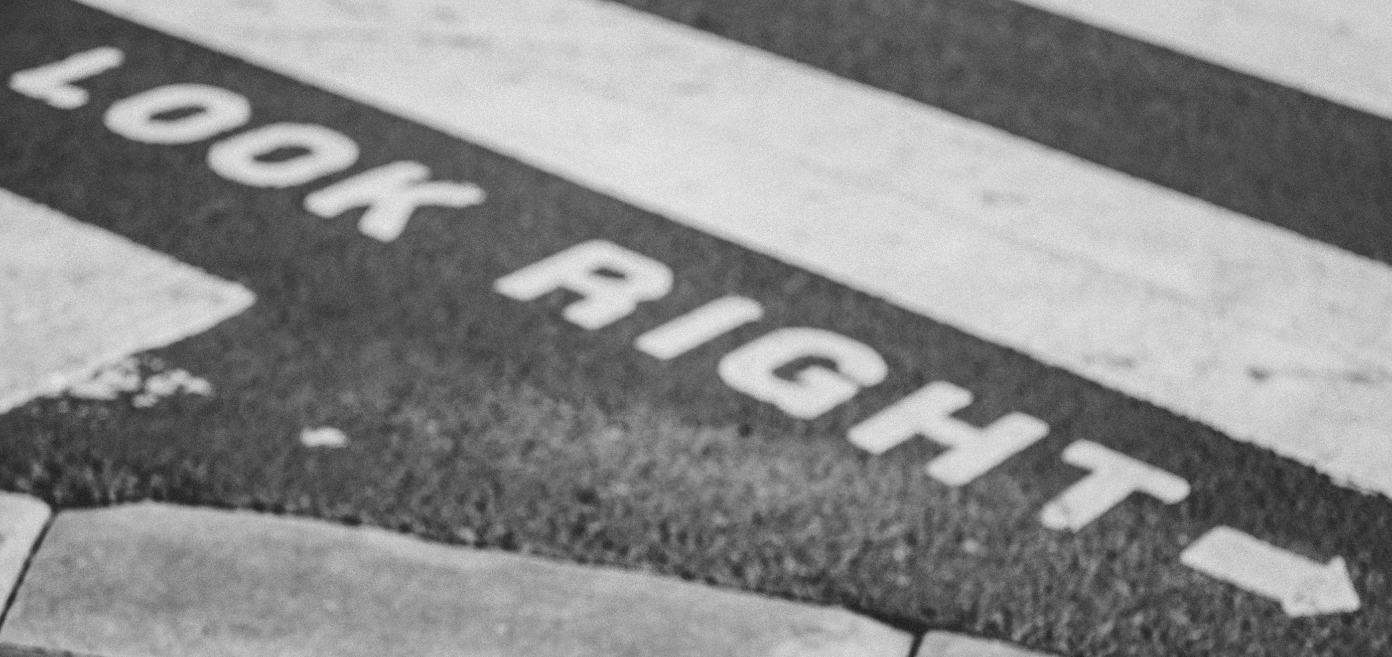 a crosswalk has been written in the street to read thai