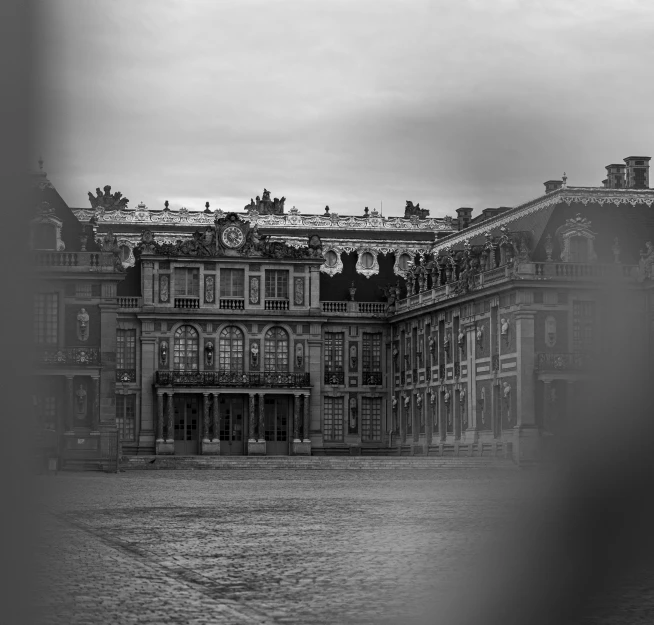 an old building with a clock tower in the background