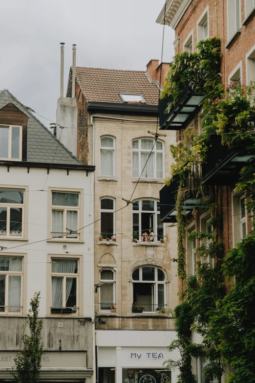 an apartment building on a corner with the windows down