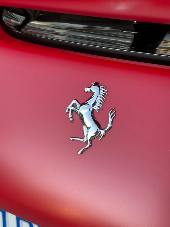 a ferrari emblem is shown on the front of a car