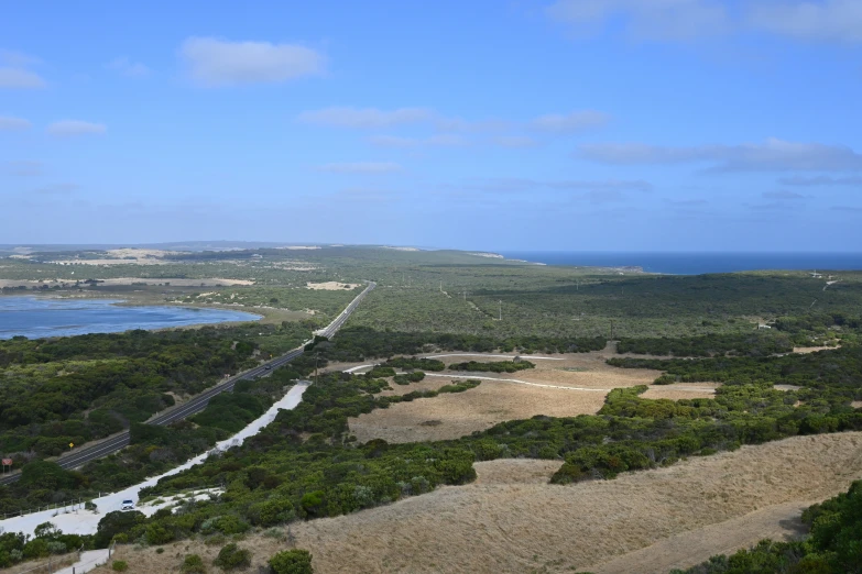 an aerial view of a large area of land and water