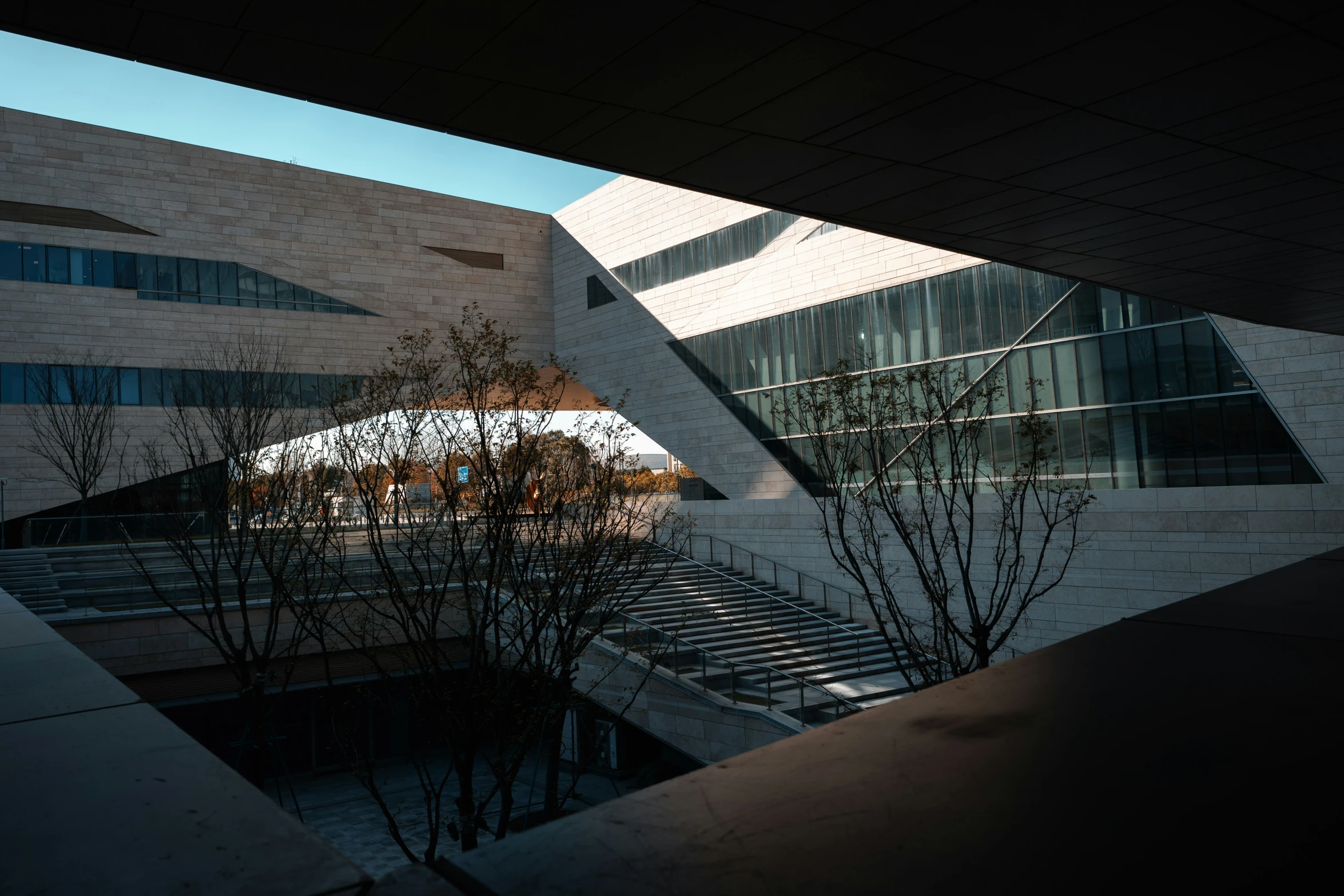 an abstract architecture is reflected in the windows of a building