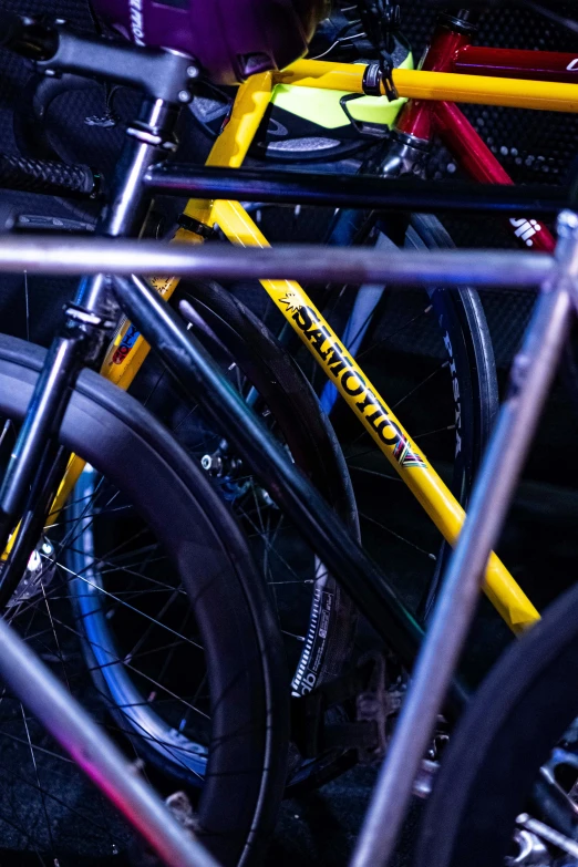 a close up of many bikes with bikes parked behind them