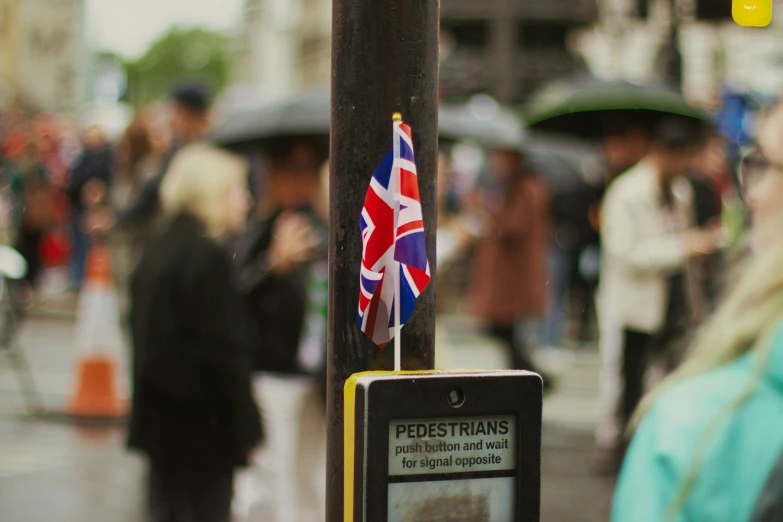 there is an union jack and british flag on the pole