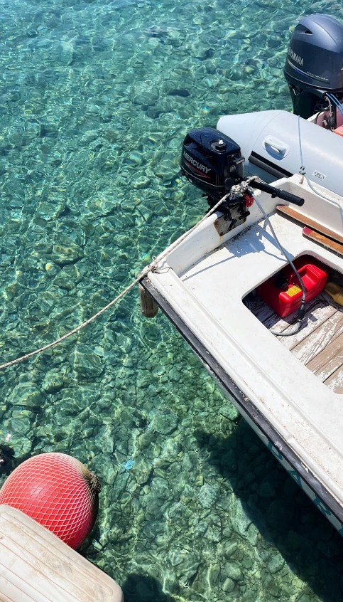 a boat tied up on a wooden dock