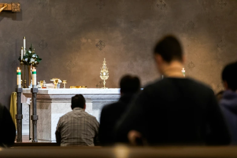 people sitting at a table in a church