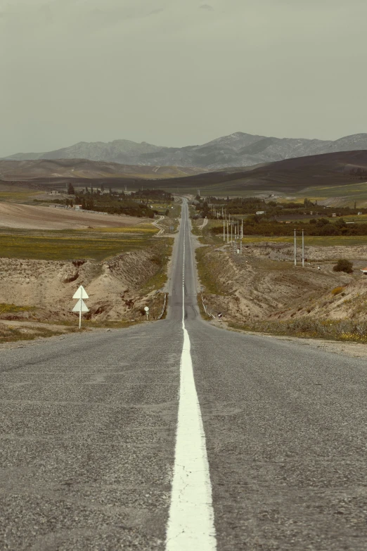 an empty road in the middle of nowhere