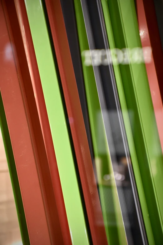 a window with green red and black trim