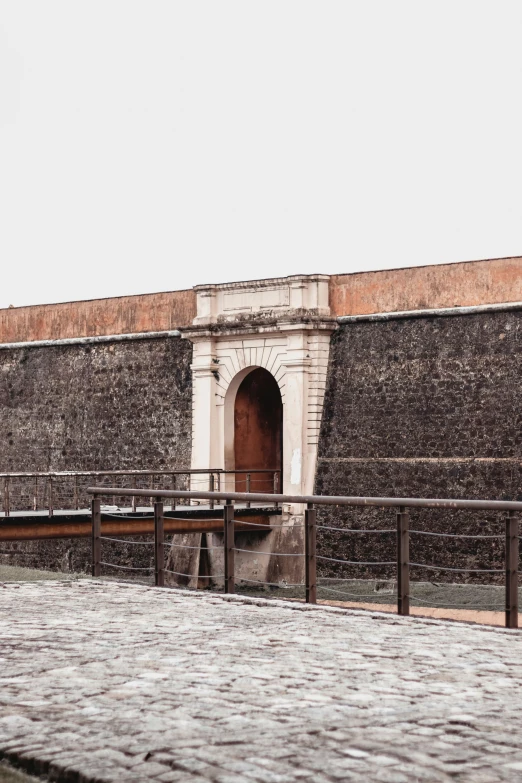 an entrance to a building that has an archway on it