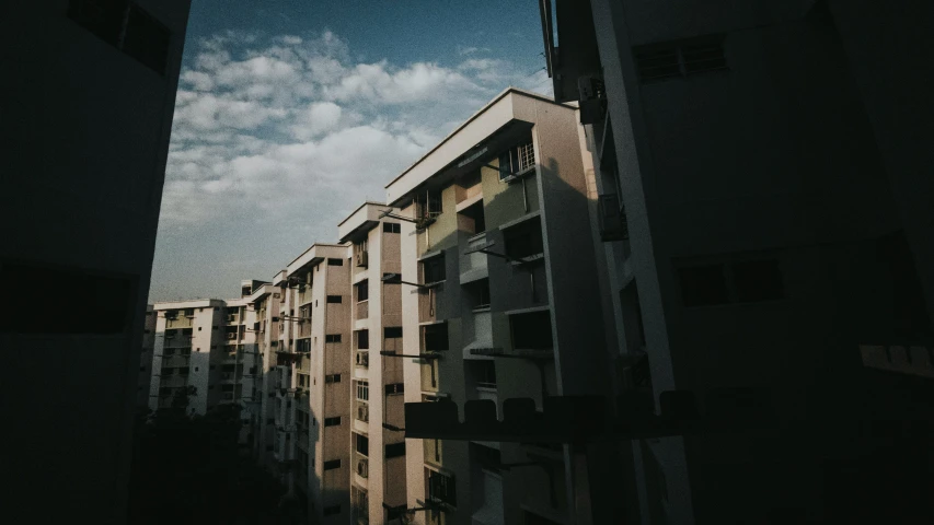 a tall building is seen through an opening