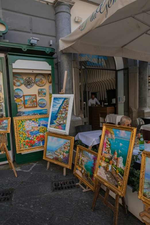 an old fashioned shop sells a number of framed maps