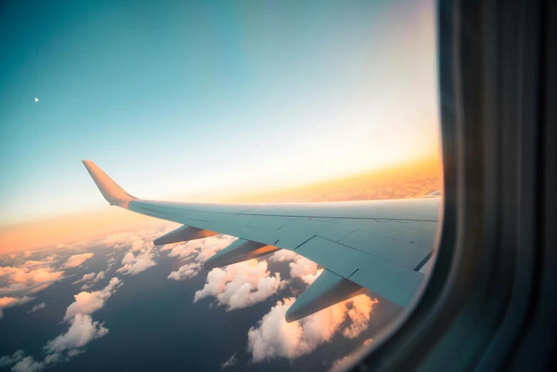 a window is open in front of some clouds