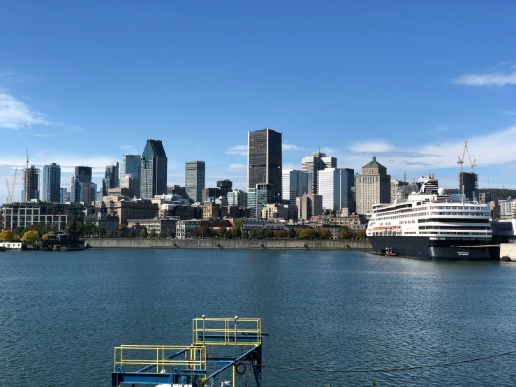 the harbor is open to boats and large city buildings