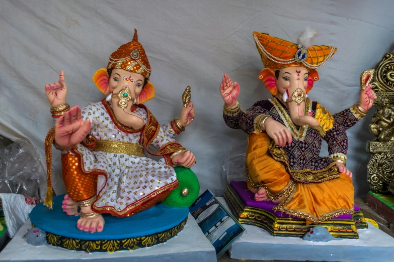 three statues of deities that are very elaborate