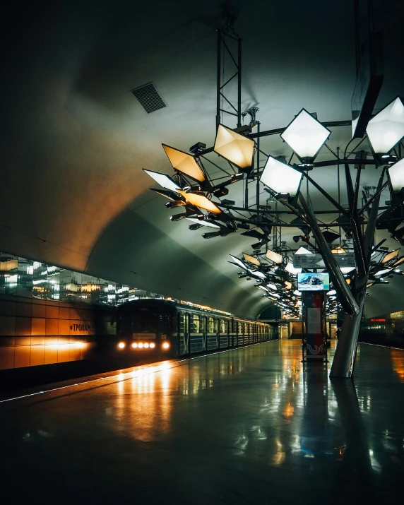 a train station with a very dark and long room