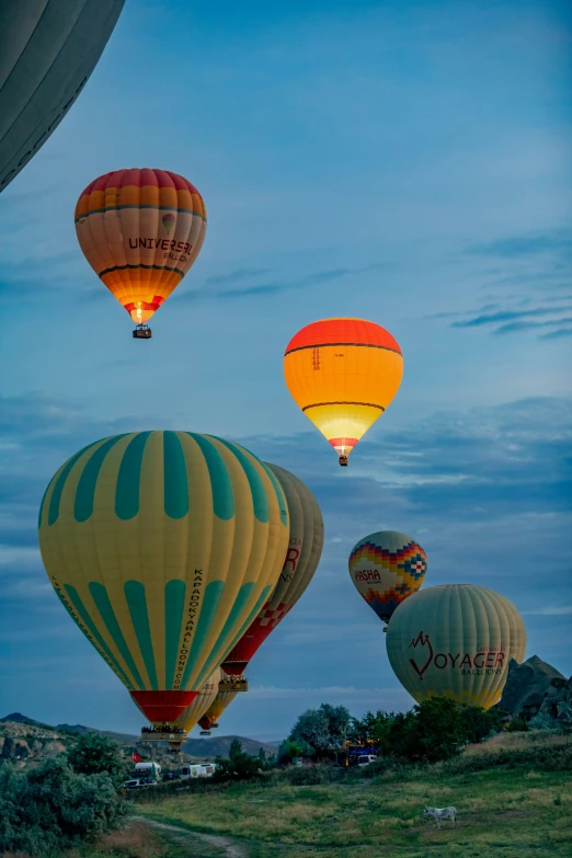 three  air balloons are flying through the sky