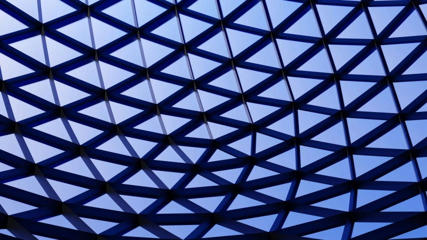 blue sky is seen through the glass of the building