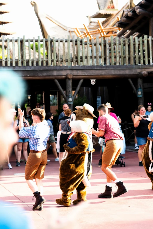 several people wearing costumes are standing around together