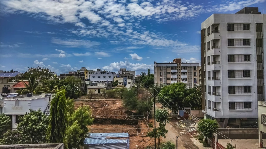 a clear, blue sky hangs over a cluster of white building