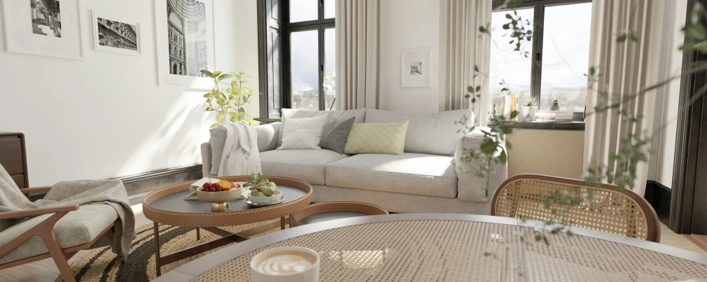 a living room has a white sofa and various pillows on it