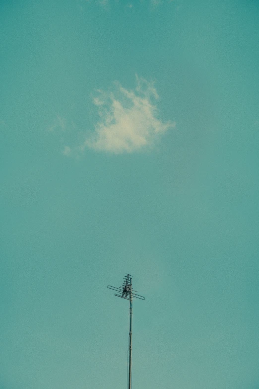 a tall tower sitting under a bright blue sky