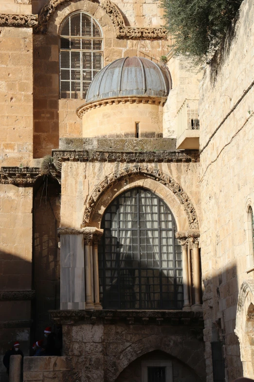 an old stone building has two windows and a dome