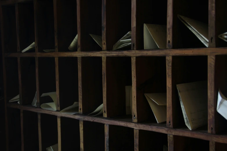 a large collection of papers is sitting on the shelf