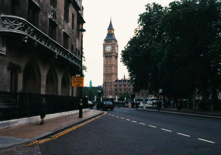 there is a large clock tower on the building across the street