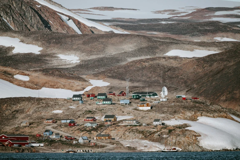 a town nestled on the mountain near the water