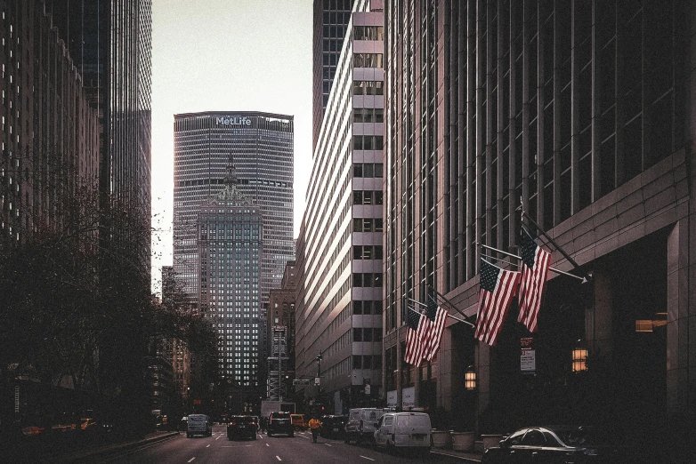 several tall buildings in a city at dusk