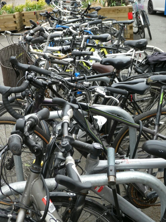 a street filled with lots of parked bikes