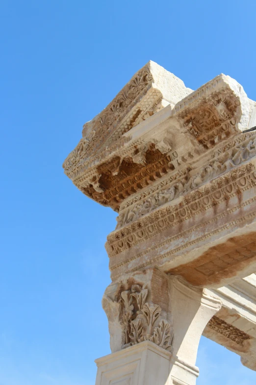 a view of part of a structure of a building with carvings on the wall and ceiling