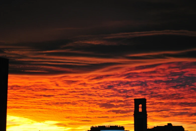 red and yellow skies are glowing over the city