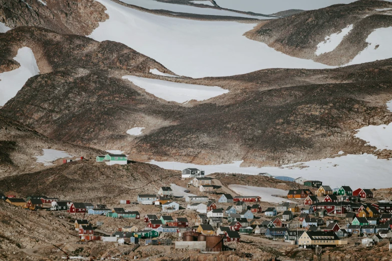 a large group of buildings in the mountains