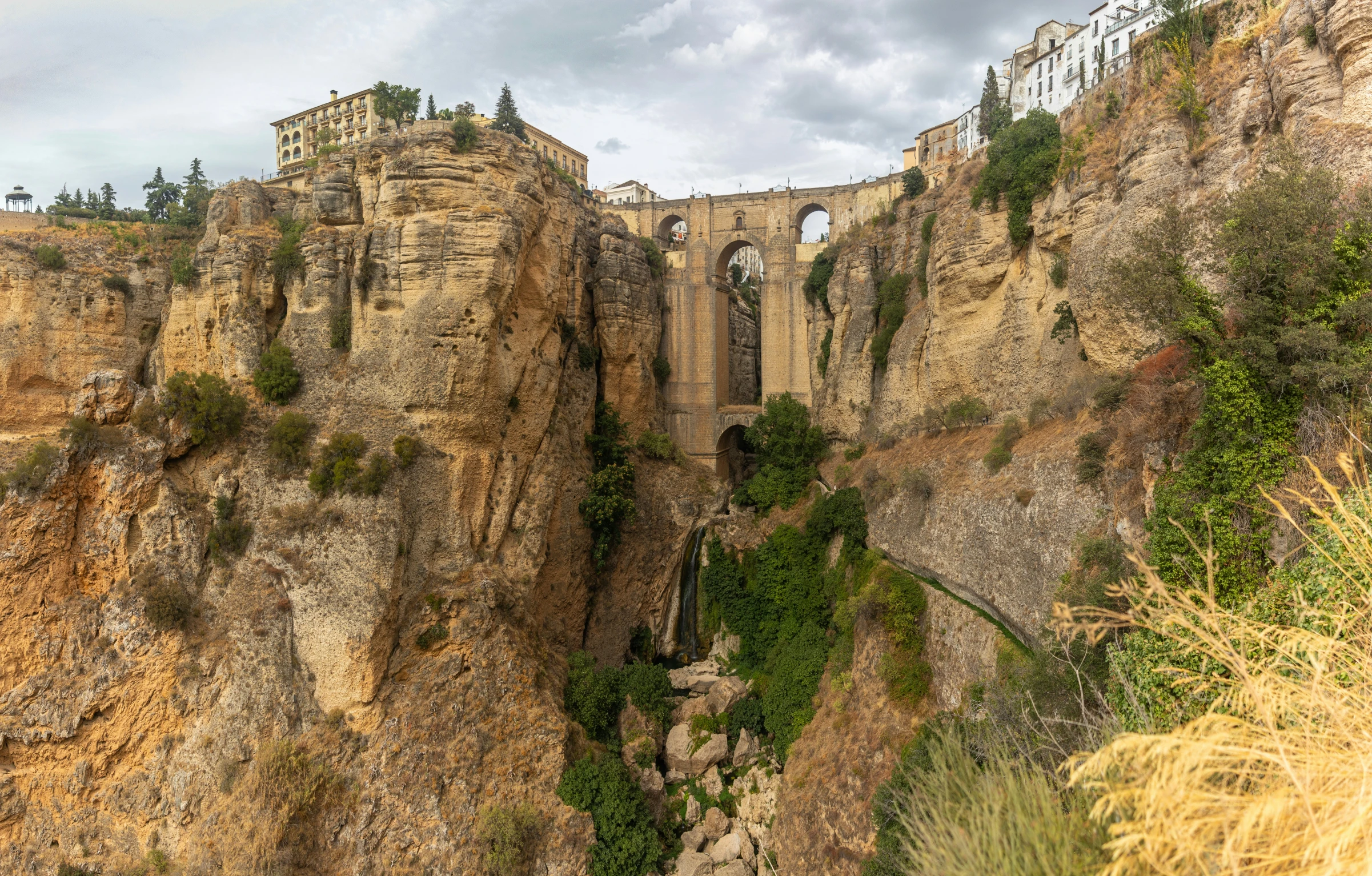 this is a po of a stone bridge built on some cliffs