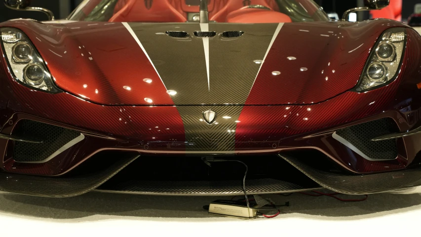 the front end of a sports car in motion