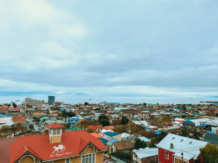 many houses in a small town under the cloudy sky