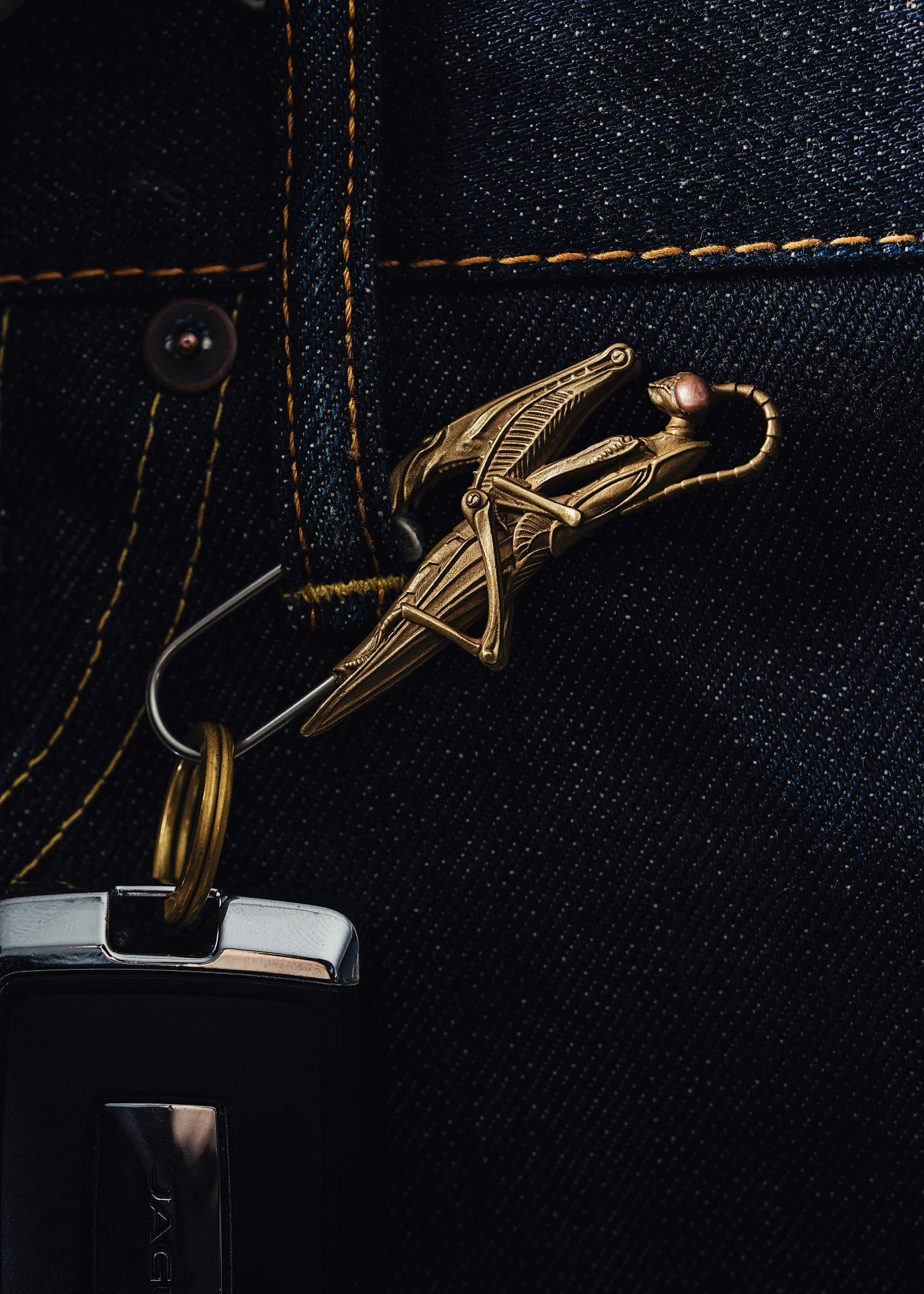 a zipper is being fastened to a pair of jeans