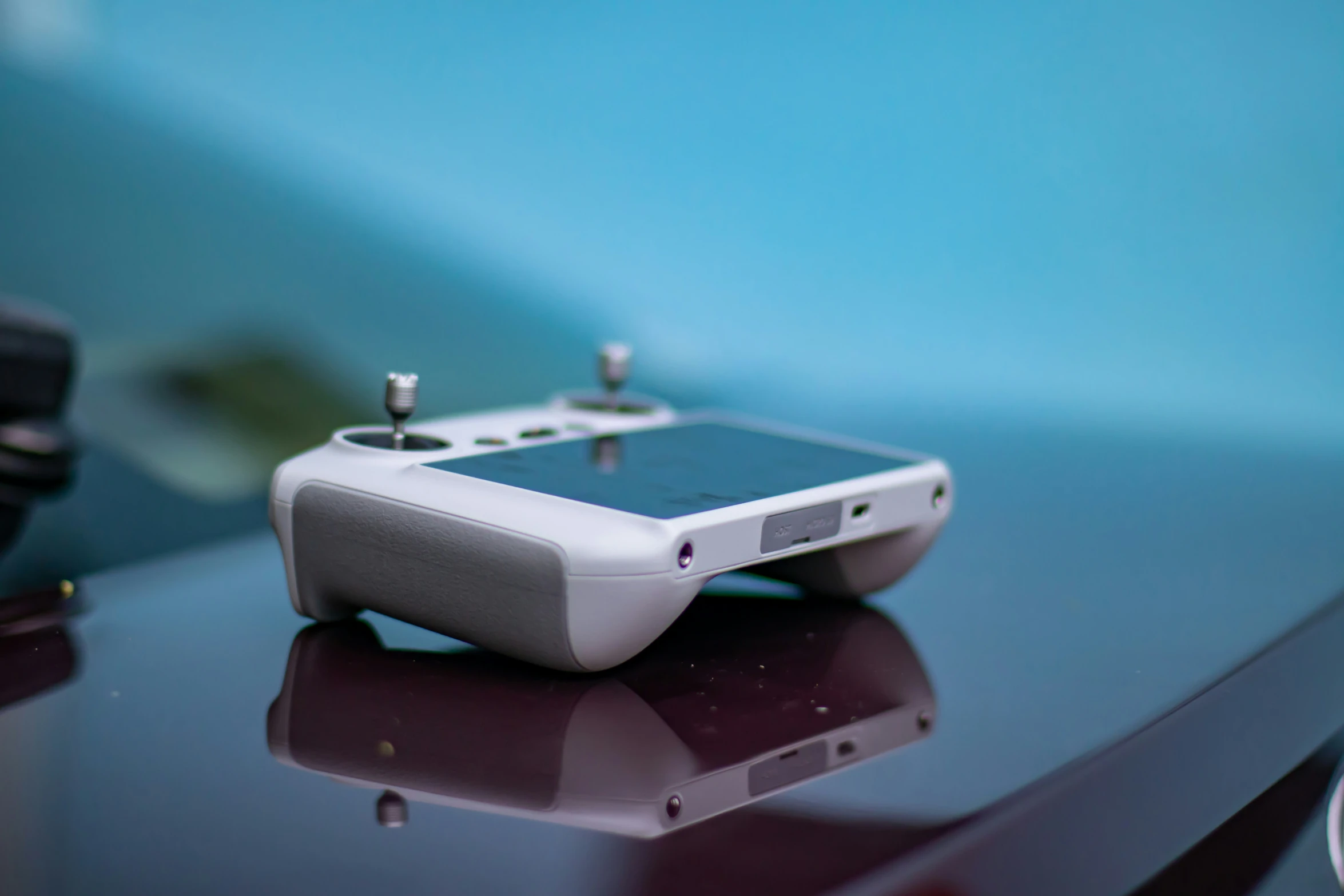 a small white device sitting on top of a table