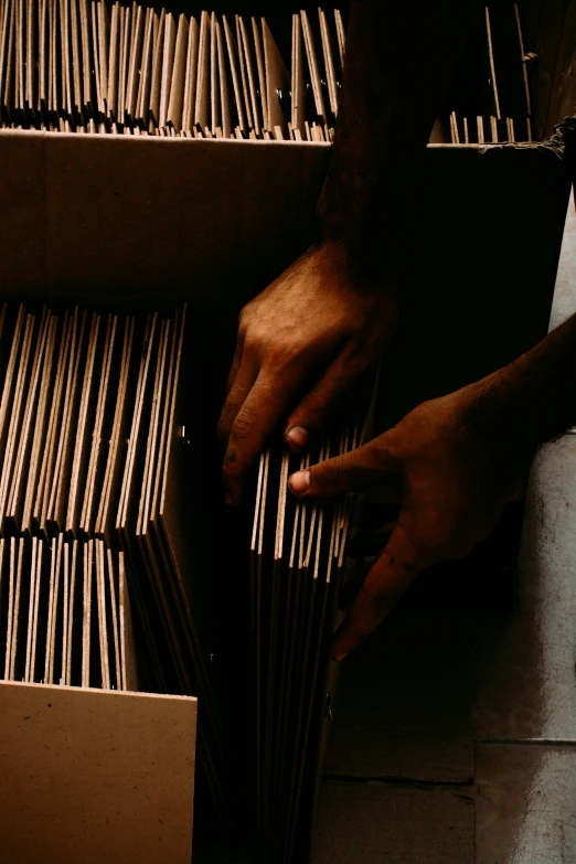 a person is reaching down on a record player