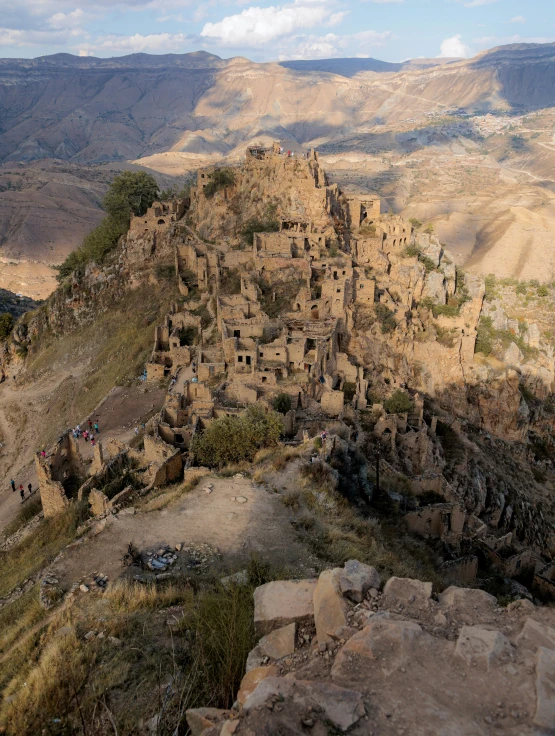 a rocky terrain with many structures on top of it