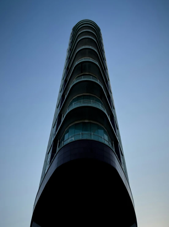 a tall tower with many balconies above it