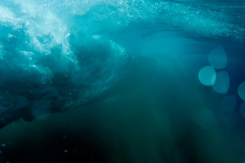 the underside of a large, wavy, blue ocean