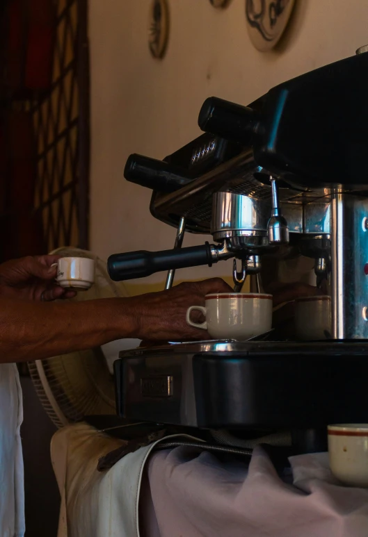 an espresso machine with coffee is on the counter