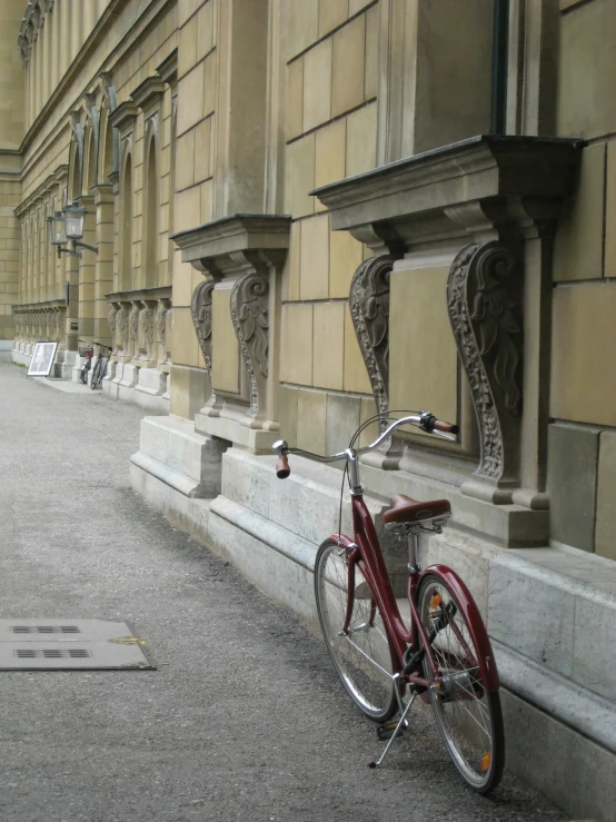 there is a bike parked next to a wall