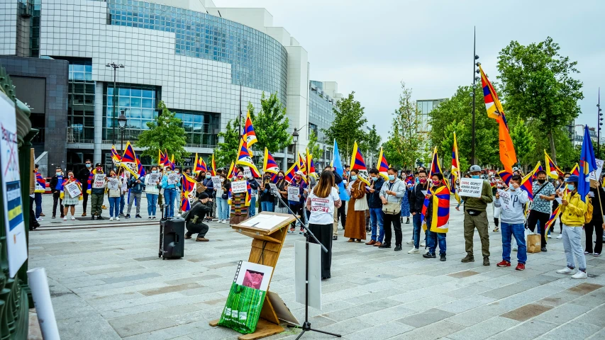 a large group of people standing in front of a building