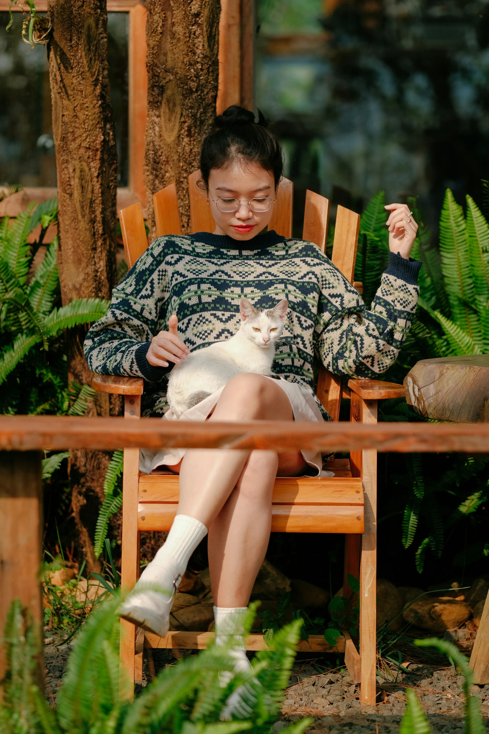 a woman wearing tights and holding a cat