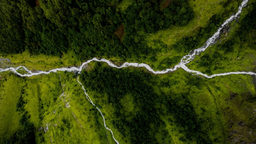 a road that goes down the side of a hill